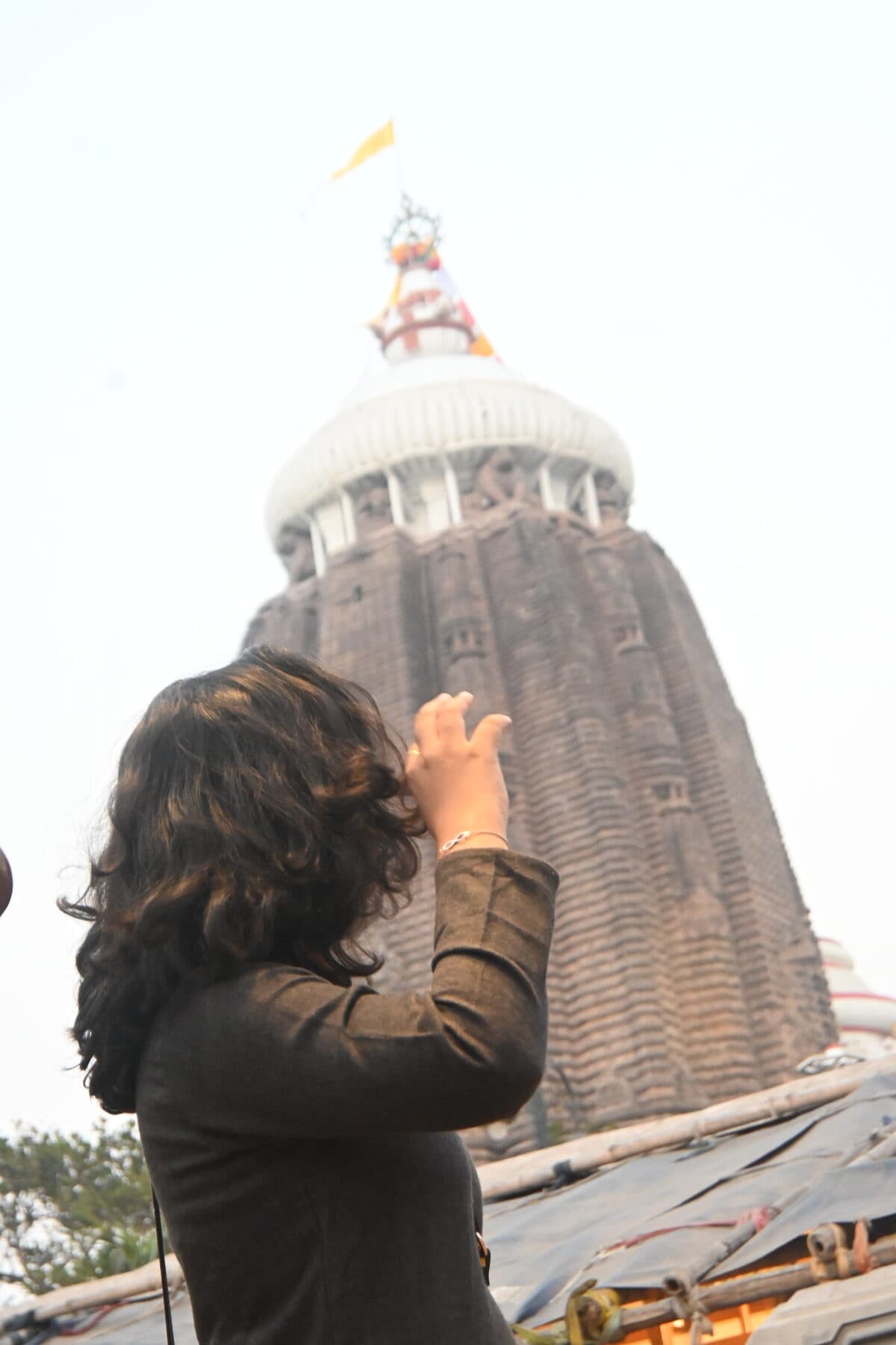 Looking up at a temple shikhara at dusk